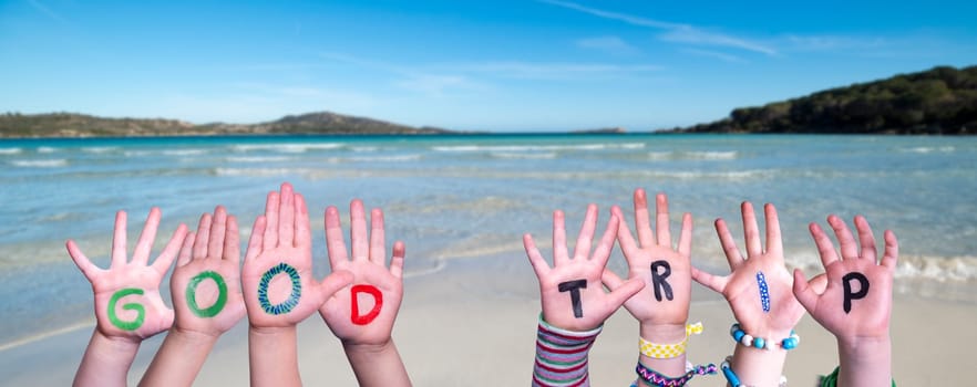 Children Hands Building Colorful English Word Good Trip. Summer Ocean, Sea And Beach As Background