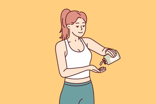 Woman fitness trainer uses sports supplements to improve health and achieve new career results. Slender beautiful fitness girl takes doping before training or important competitions