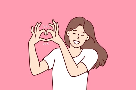 Woman demonstrates gesture of heart made of fingers flirting with boyfriend or beloved husband calling for love and being romantic. Girl shows heart with hands to call for kindness and mercy.