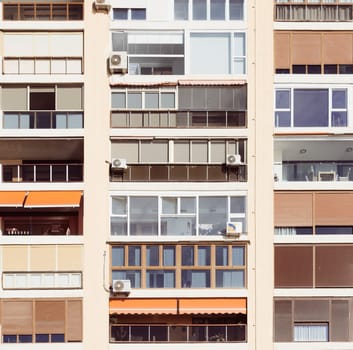Malaga, Spain, April 2023: Front view of generic high-rise apartment building
