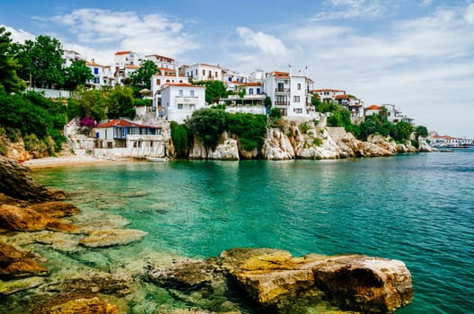Old town view of Skiathos island, Sporades, Greece. Greek traditional architecture and aegean sea. Popular summer holiday destination scene.