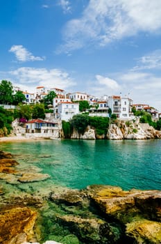 Old town view of Skiathos island, Sporades, Greece. Greek traditional architecture and aegean sea. Popular summer holiday destination scene.