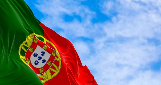 Portugal national flag waving in the wind on a clear day. Portuguese Republic is a Member State of the European Union. 3d illustration render. Fluttering fabric