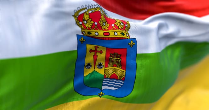 Detail of La Rioja flag waving. Autonomous community of Spain.Red, white, green, and yellow bands with coat of arms. 3d illustration render. Selective focus. Close-up. Fluttering textile