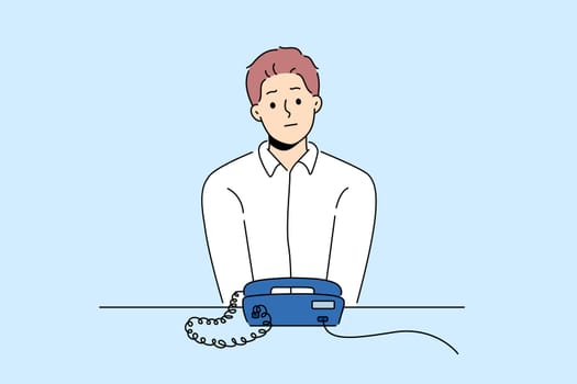 Unhappy man sit at desk look at landline phone waiting for someone call. Frustrated guy awaiting ring looking at corded telephone. Vector illustration.
