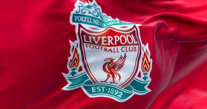 Liverpool, UK, Apr. 2023: Liverpool Football Club flag waving. Liverpool F.C. is an english professional football club. Fabric textured background. Illustrative editorial 3d illustration render