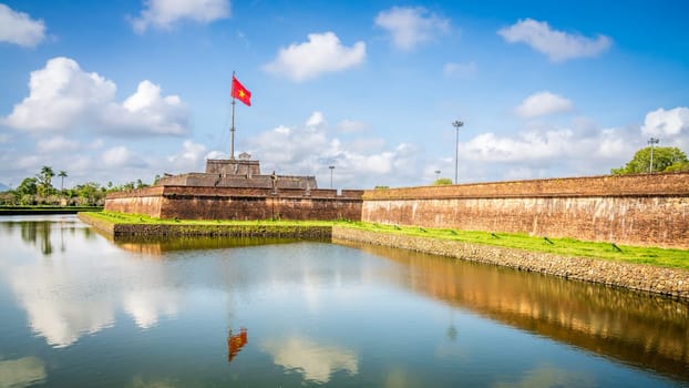 National flag of Vietnam flies over the Citadel in the former capital city of Hue