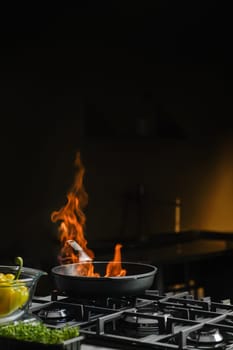 Open and controlled fire in a frying pan