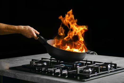Process of flambering food ingredients in a frying pan