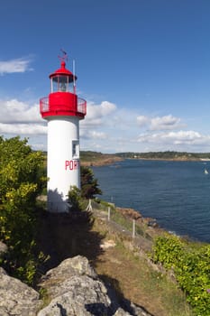 Port Manec'h Lighthouse against blue sky. Brittany, France