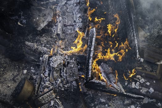 Detail of wood burning with fire and flames, destruction