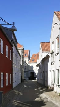 Morning shot of colored houses on a alley in the small town of Aalborg, Denmark