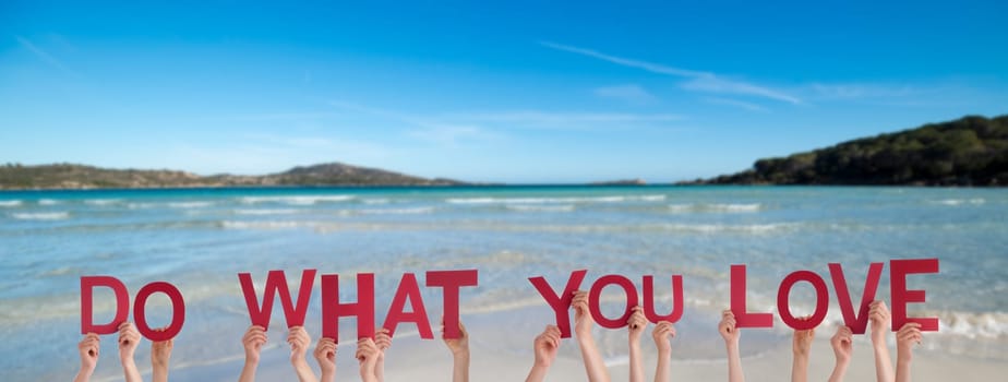 People Or Persons Hands Building English Word Do What You Love. Summer Ocean, Sea And Beach As Background.