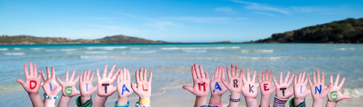 Children Hands Building Colorful English Word Digital Marketing. Summer Ocean, Sea And Beach As Background.