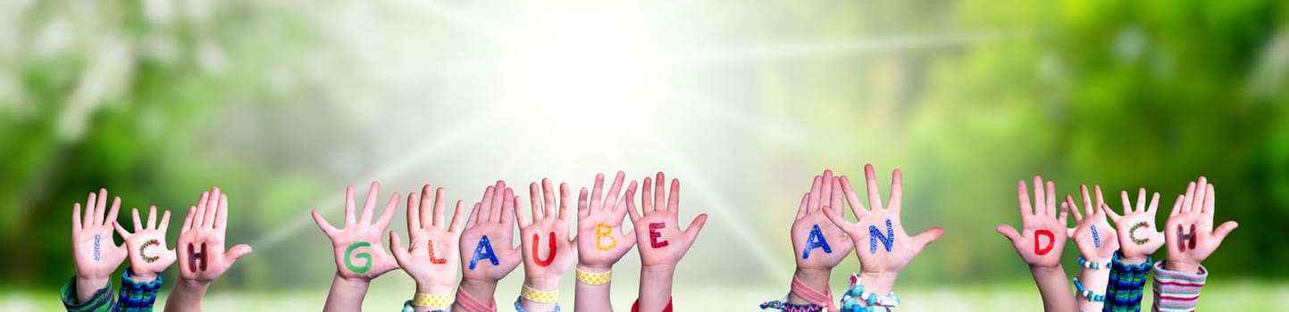 Children Hands Building Colorful German Word Ich Glaube An Dich Means I Believe In You. Sunny Green Grass Meadow As Background.