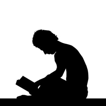 Silhouette of a young man reading a book