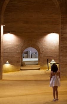 Merida, Spain - Sept 4th, 2018: National Museum of Roman Art in Merida, Spain. Little girl visiting the Crypt