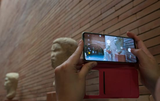Merida, Spain - May 23th, 2021: Visitor taking pictures at National Museum of Roman Art in Merida, Spain
