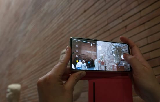 Merida, Spain - May 23th, 2021: Visitor taking pictures at National Museum of Roman Art in Merida, Spain