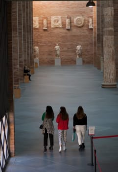 Merida, Spain - November 14th, 2020: National Museum of Roman Art in Merida, Spain. Three female visitors