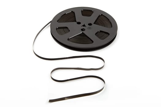 Black reel to reel music tape isolated over white background