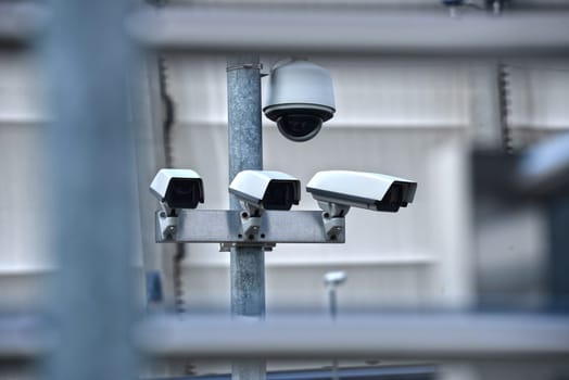 High tech overhead security camera system installed in guarded industrial area.