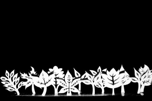 Artistic wooden trees and plants in a line