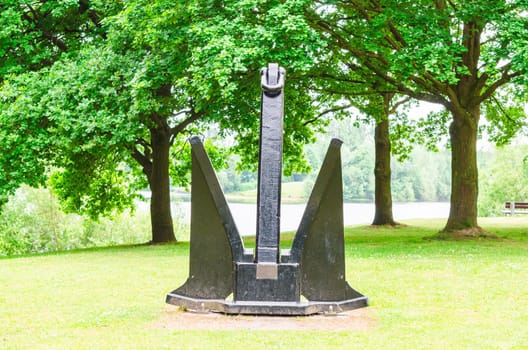 Age of large black ship anchors in a public park in Ratingen.