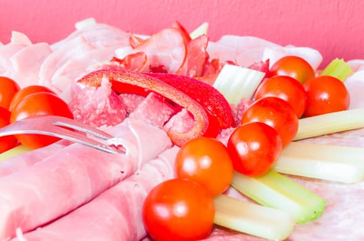 Meat platter,sausage plate with different sausages and vegetables.