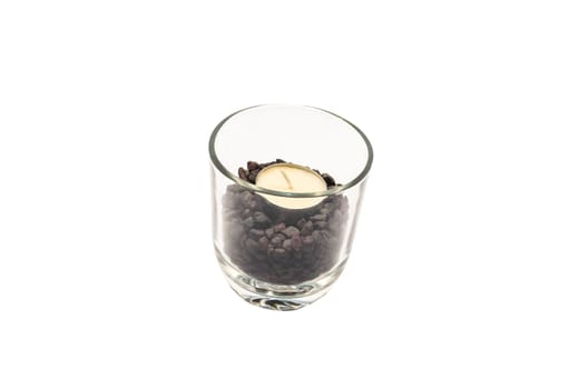 Candle in a transparent glass on a white background.