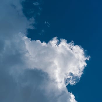 big white cloud in the sky on a warm summer day
