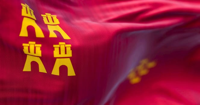 Detail of the Murcia flag waving. Autonomous community of Spain. Four castles and seven crowns on a crimson background. 3d illustration render. Selective focus. Close-up. Fluttering fabric