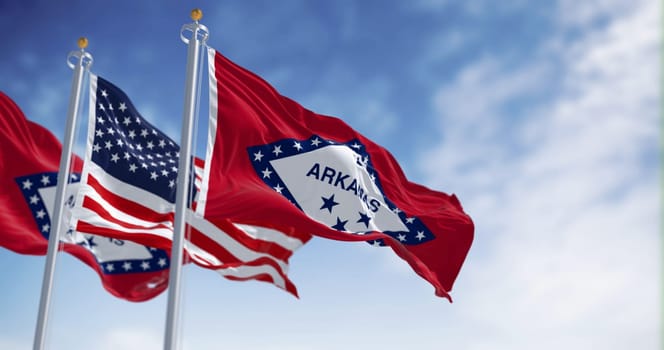 Arkansas state flags waving with the national flag of the United States of America on a clear day. Fluttering fabric. 3d illustration render