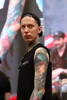 Krakow, Poland -  June 12, 2022: Unidentified  participant at 15th Tattoofest Convention in Cracow. One of the most prestigious tattoo festivals.