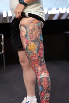 Krakow, Poland - June 12, 2022: Unidentified participant during the contest for the best tattoo at the 15th Tattoofest Convention in Cracow. One of the most prestigious tattoo festivals.