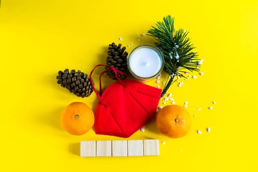New Year's conceptual background. Christmas tangerines and medical mask. Plans for 2022