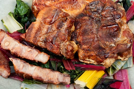 Delicious grilled meat steak and fresh herb salad. Top view.