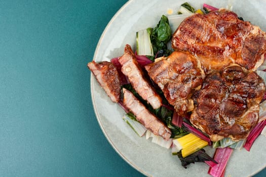 Delicious grilled meat steak and fresh herb salad. Top view.