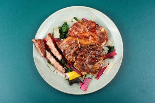 Delicious grilled meat steak and fresh herb salad. Top view.