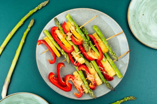 Diet skewers of asparagus, peppers and cheese. Grilled skewers vegetables. Copy space.