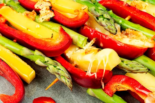 Colorful skewers of asparagus, peppers and halloumi cheese. Meat free