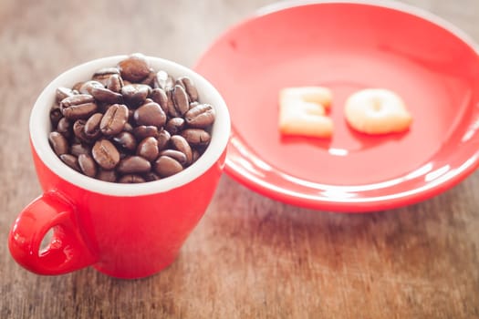 EQ alphabet biscuit with red coffee cup, stock photo