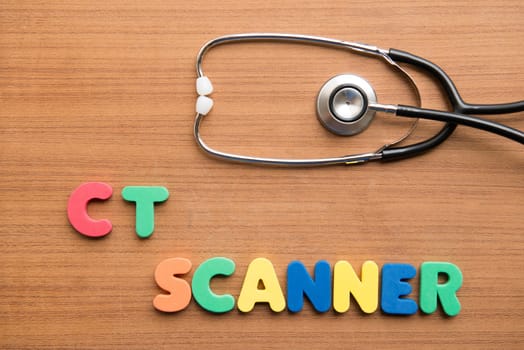CT scanner colorful word with stethoscope on the wooden background