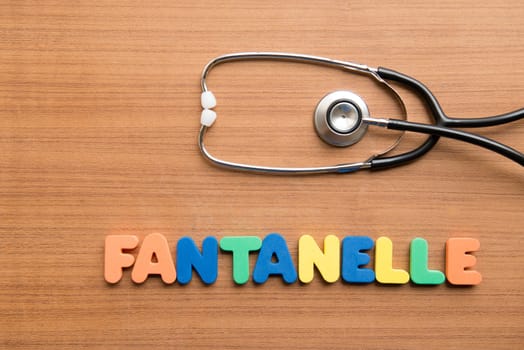 Fontanelle colorful word with stethoscope on the wooden background