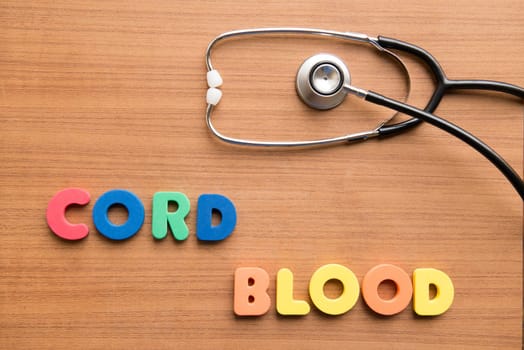 cord blood colorful word with stethoscope on the wooden background