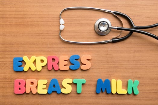 Express breast milk (EBM) colorful word with stethoscope on the wooden background