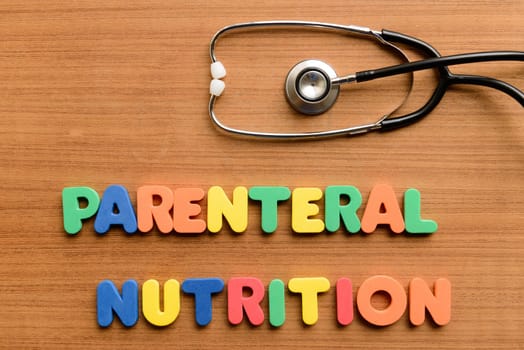 Parenteral nutrition colorful word on the wooden background