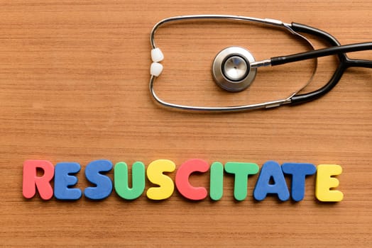 Resuscitate colorful word on the wooden background