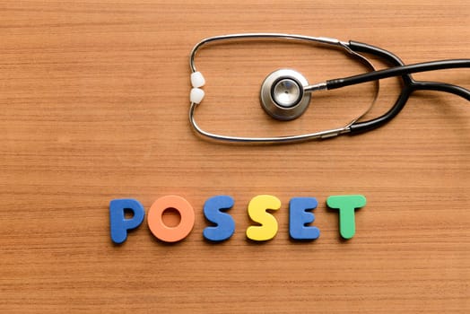 Posset colorful word on the wooden background