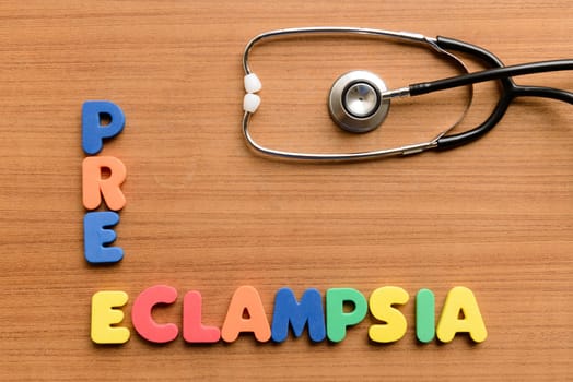 Pre-eclampsia colorful word on the wooden background